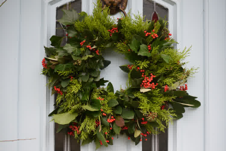 A christmas wreath on a house door